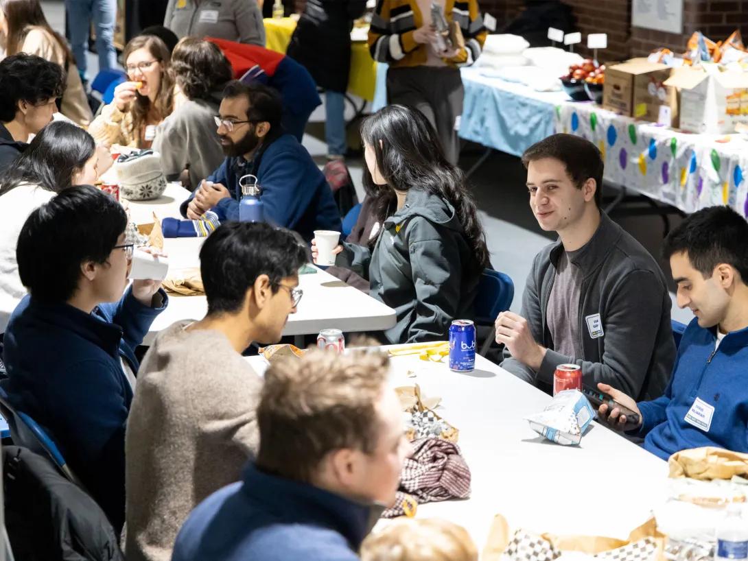 Many people sitting around a table during a seminar lunch