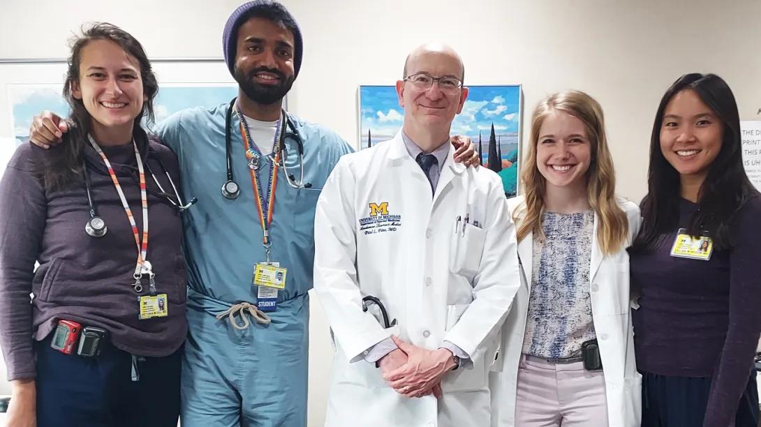 Dr. Paul Fine stands with four members of his hospital team.