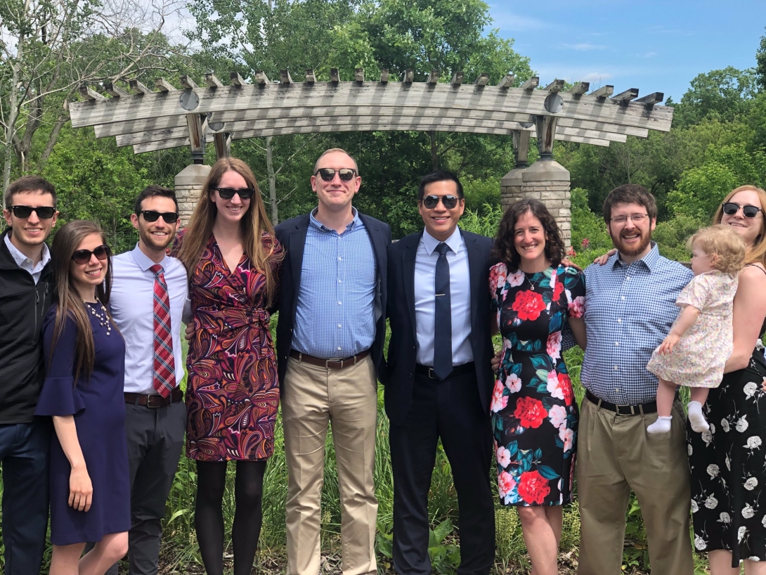 Residents post for a photo outside