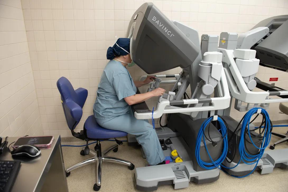 A doctor performs a robotic kidney transplant