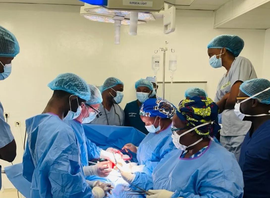 Jeffrey Punch works with a trainee on a kidney transplant