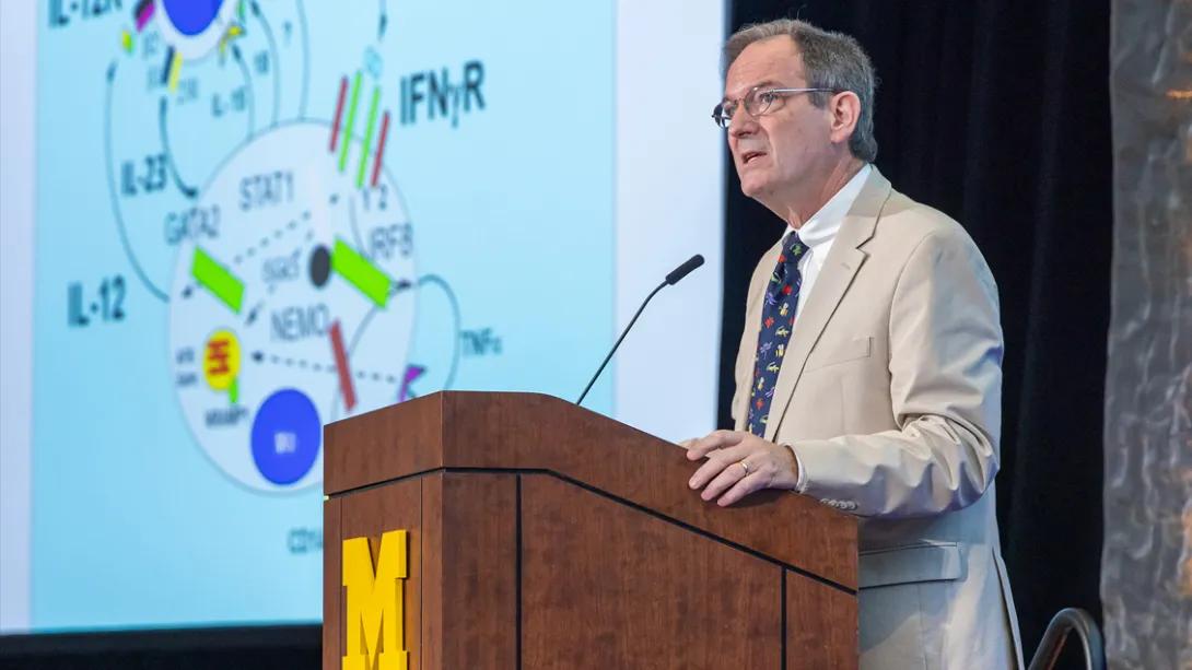 Dean’s Lecture Series with a speaker at a podium