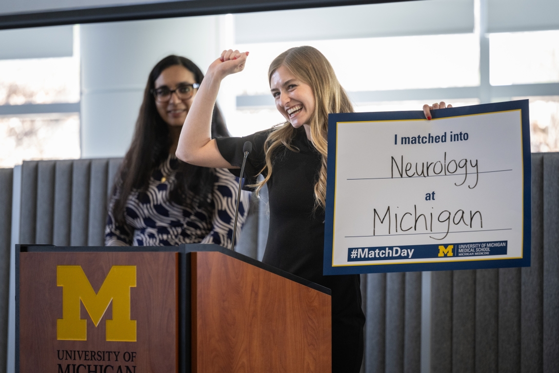 Student holds up a sign during Match Day