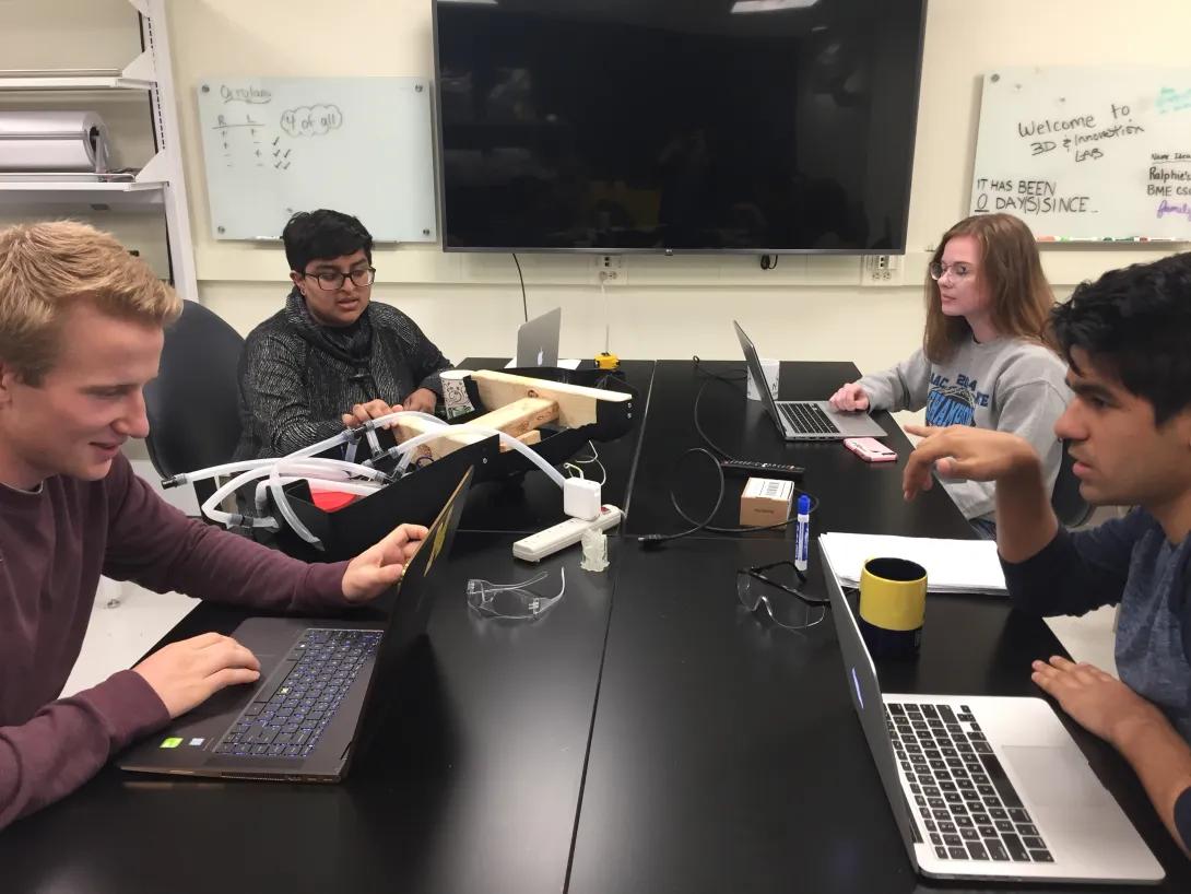 students working around a table