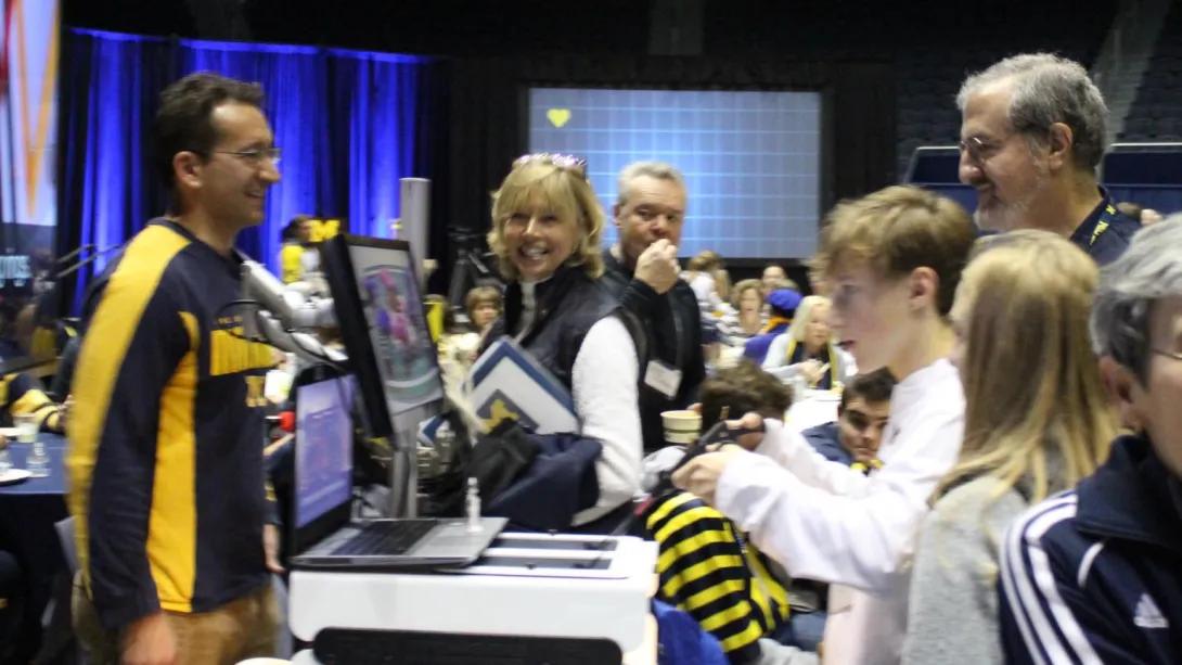 People gathering to watch a simulation