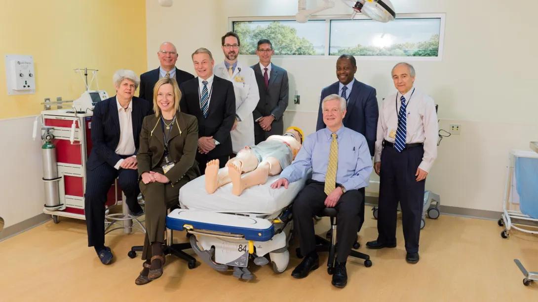A group of people in a patient room