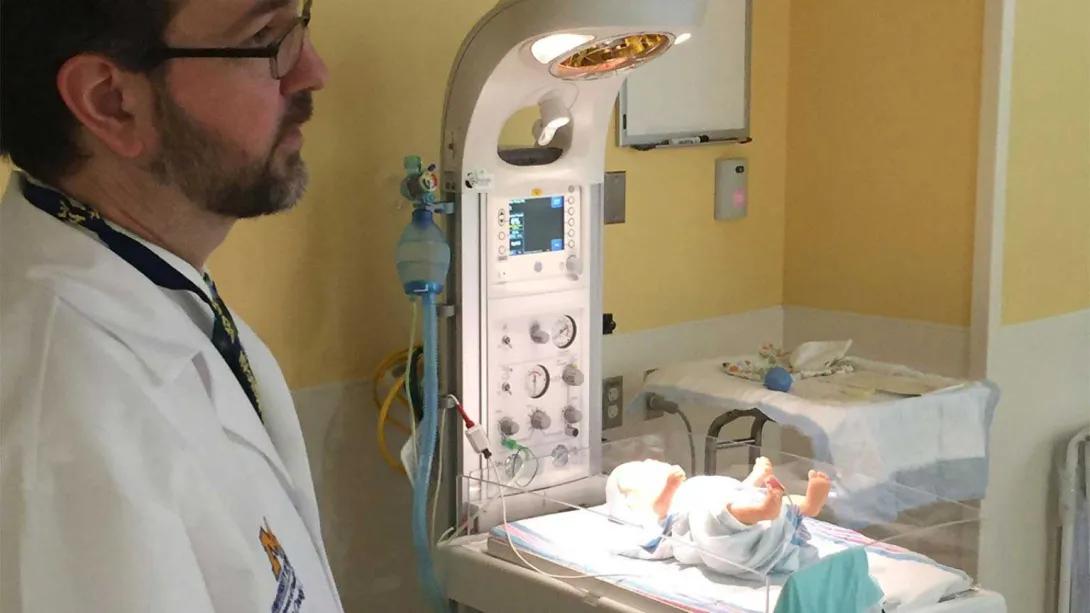Dr. Jim Cook with a preemie