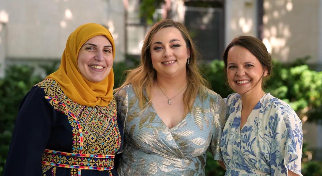 three women smiling 