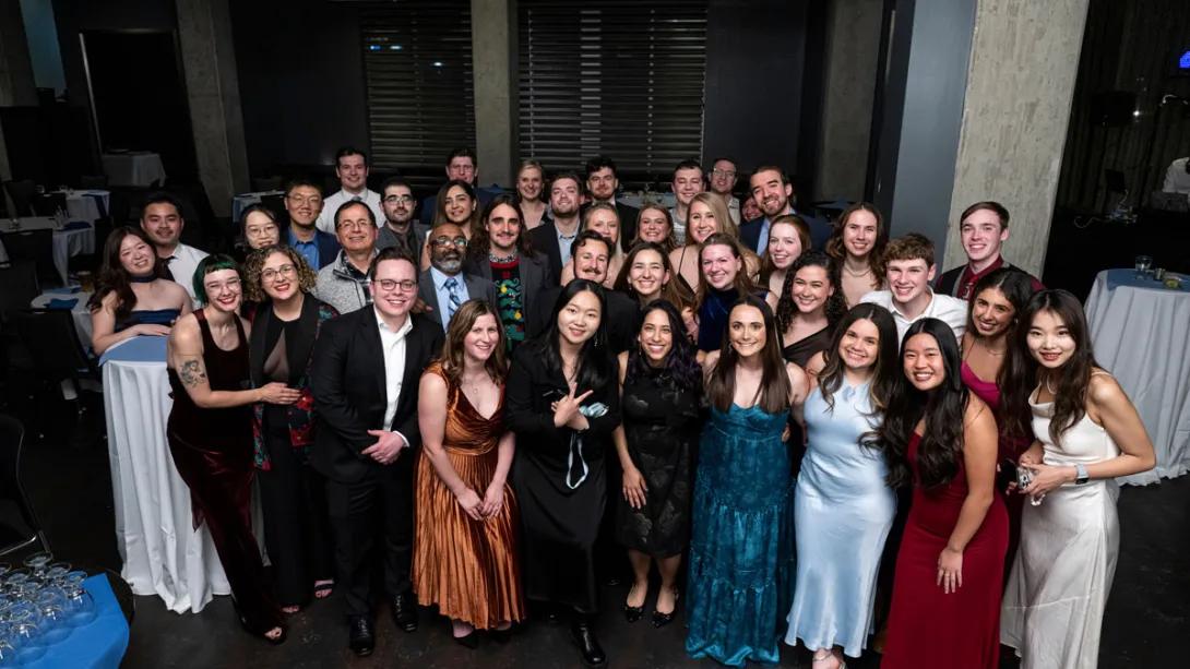 Researchers pose for group photo at winter formal