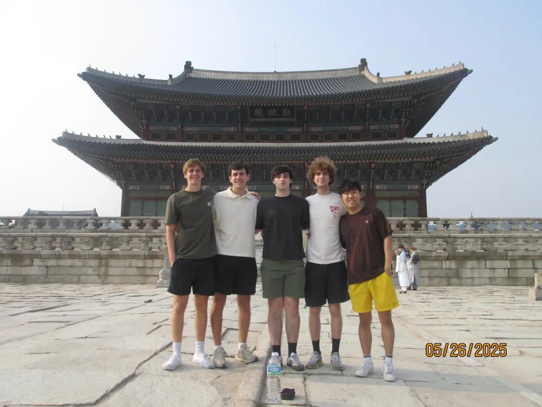 Ethan king stands in front of pagoda in Korea