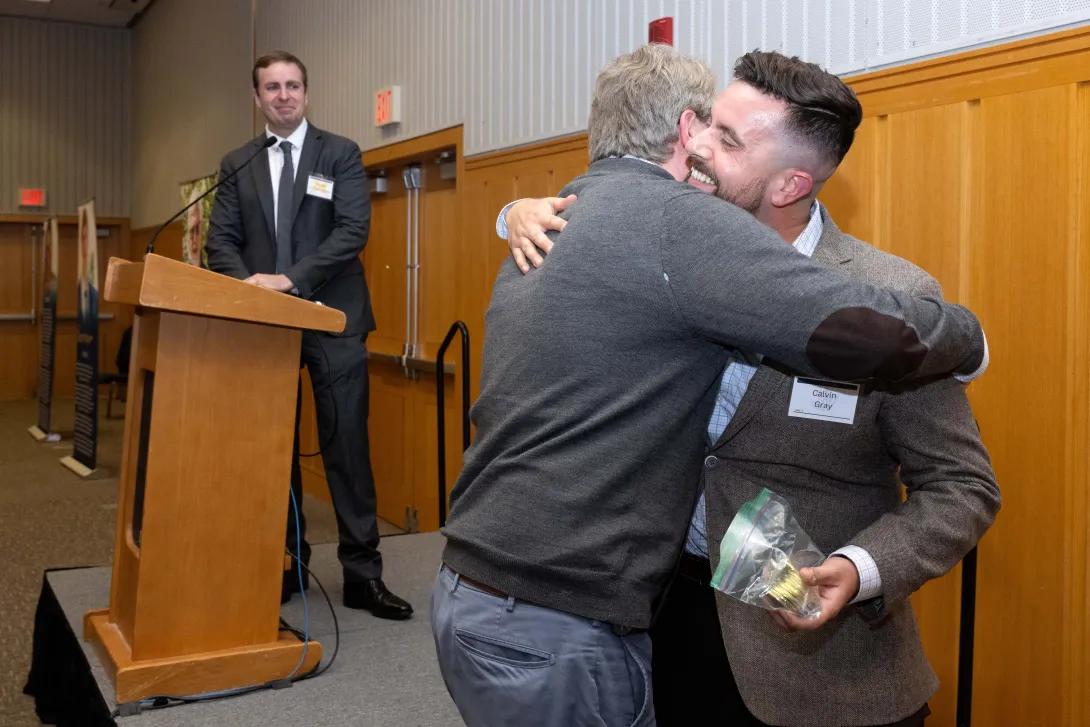 calvin gray hugs a team member