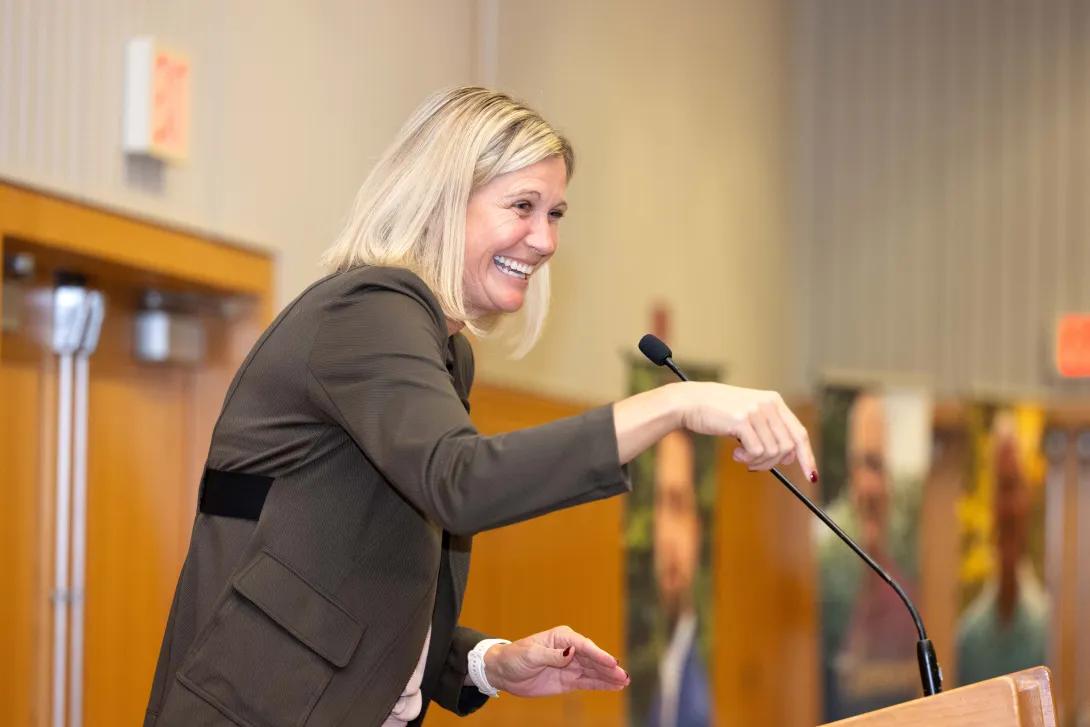 courtney reid laughs at podium