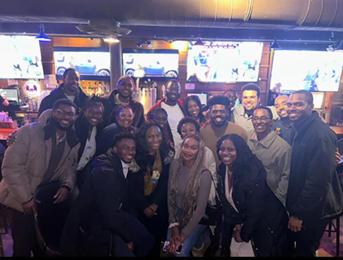 A large group of Black medical students pose for a group photo