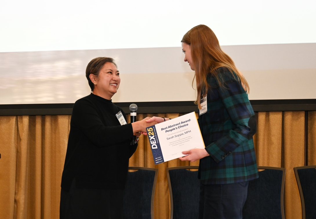 An award winer gets her certificate