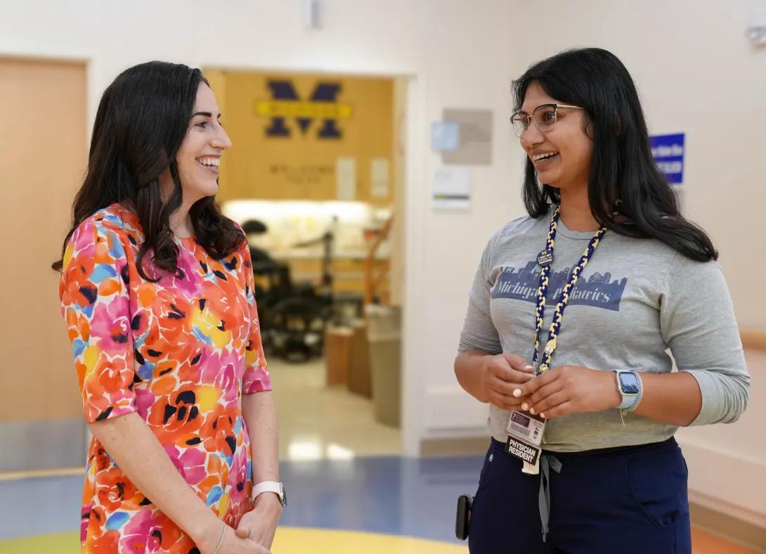 Rachel Gottlieb-Smith speaks with a colleague.