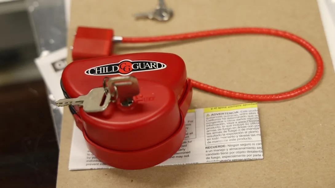 safe lock up close red lock with key in it