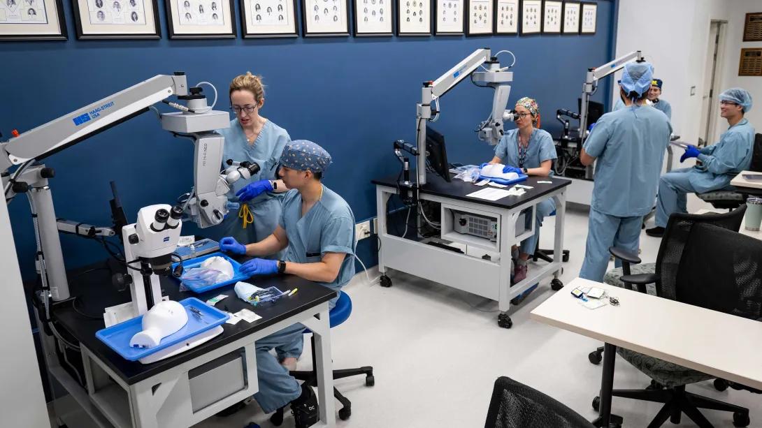 Wide view of the Kellogg Eye Center wet lab with multiple surgical training stations.