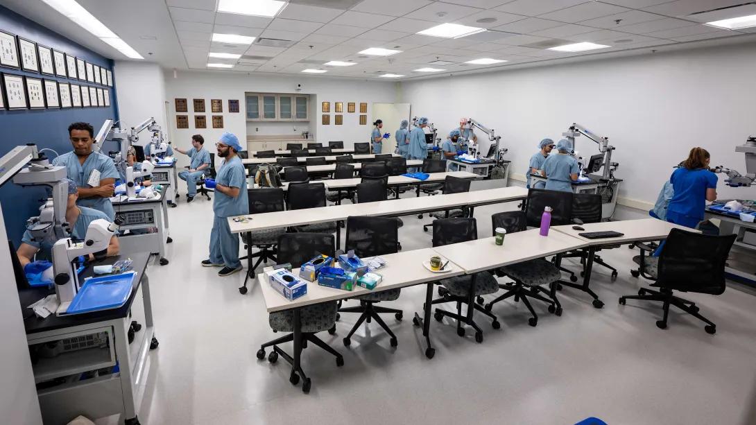 Ophthalmology residents train together in the Kellogg Eye Center wet lab.