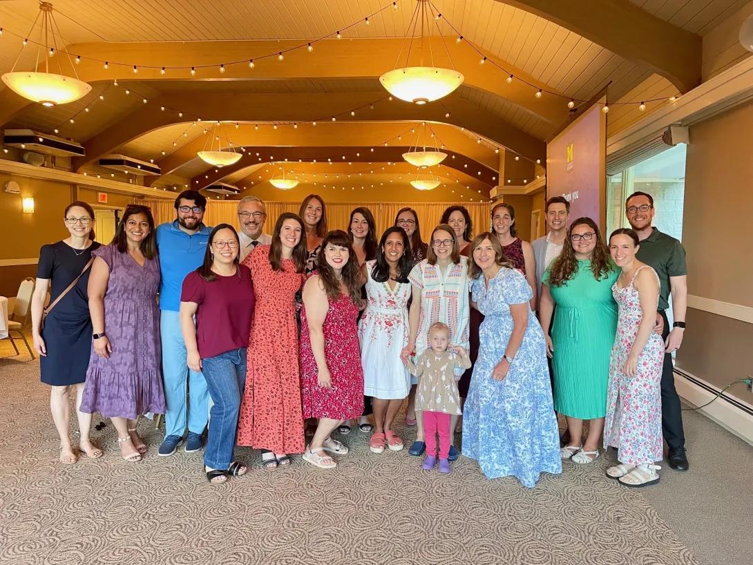 Graduating hospital medicine fellows pose with faculty and staff during the fellowship graduation celebration.
