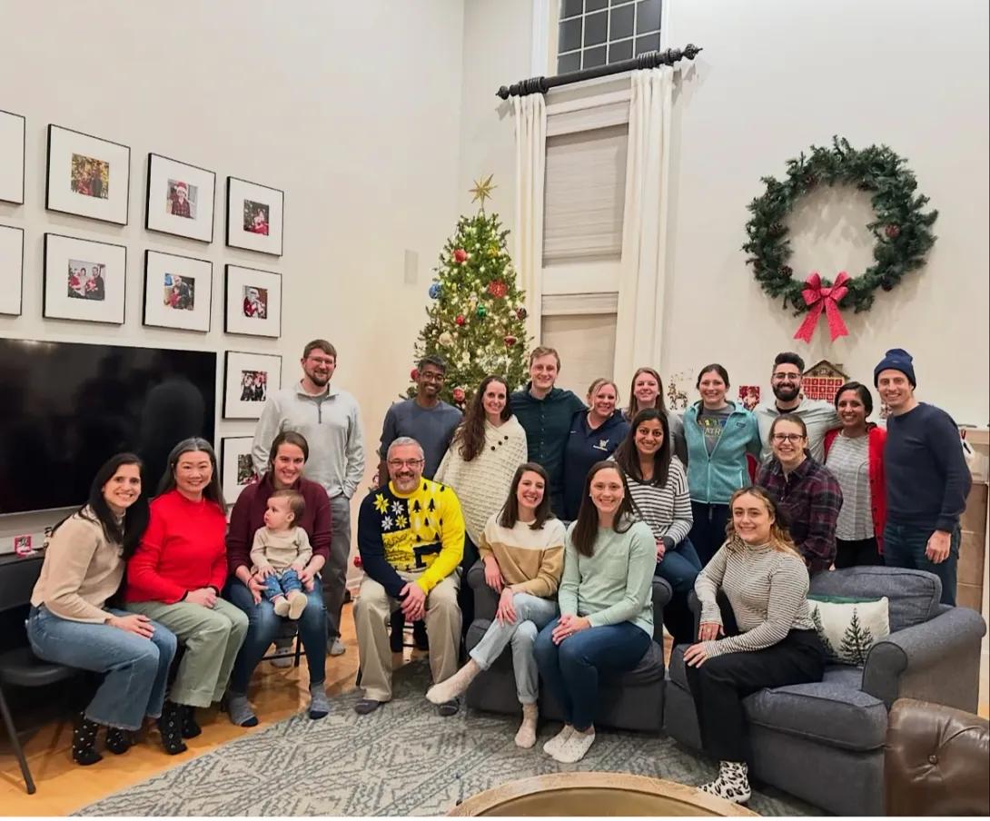 Hospital Medicine faculty and fellow posing for their annual Holiday Celebration.
