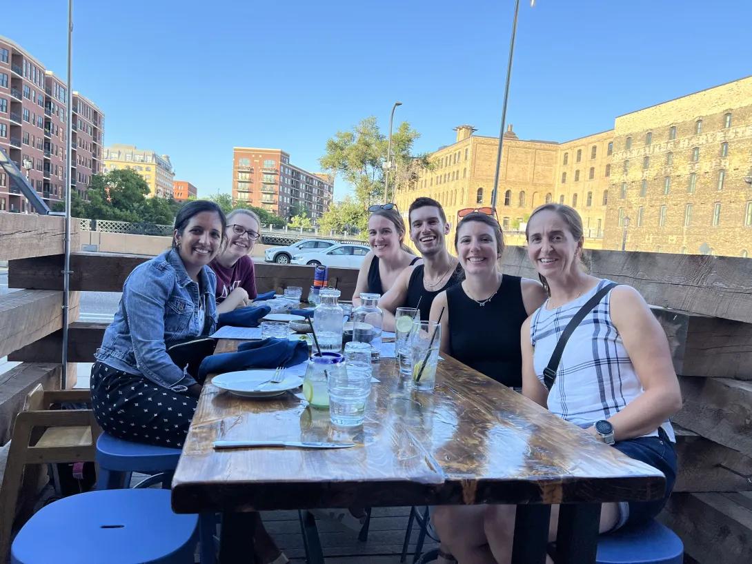 Hospital medicine fellows enjoying a meal together.