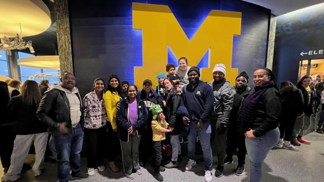 Rwandan OBGYN fellows and faculty cheering on UM basketball 
