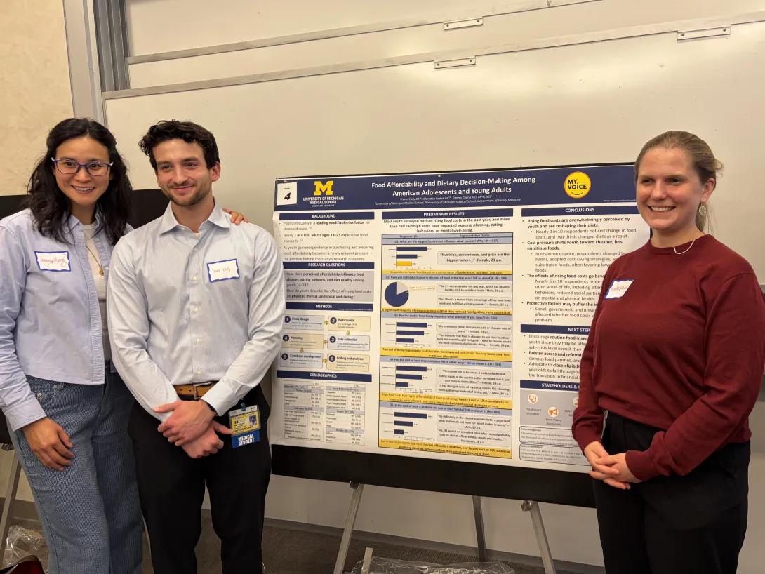 Tammy Chang, Trevor Cady, and Meredith Redick with their poster that reads “Food Affordability and Dietary Decision-Making Among American Adolescents and Young Adults.”